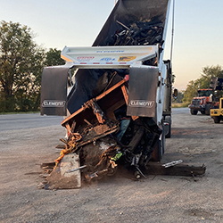 Dump truck dumping it's contents at Trash Bash.